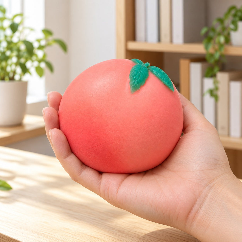 Crunchy Peach Squishy, Handmade, held in a hand to show the real size