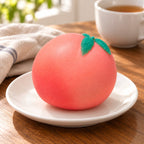 Crunchy Peach Squishy, Handmade, on a plate on a breakfast table