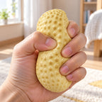 Crunchy Peanut Squishy, being squeezed by hand, soft and squishy