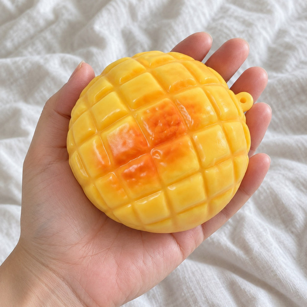 Pineapple bun squishy crunchy, held toward the camera, first-person view