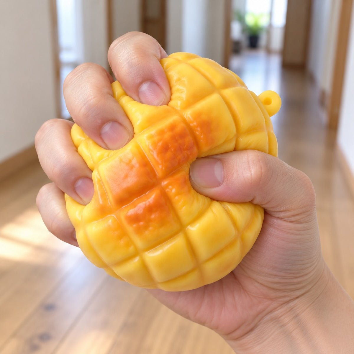 Pineapple bun squishy crunchy, being squeezed by hand, soft and squishy