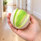 Crunchy Pistachio Squishy, Handmade, held in a hand to show the real size