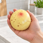 Potato squishy crunchy, held in a hand to show the real size