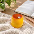 Pudding squishy crunchy, on a desk with a notebook and pencil
