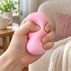 Crunchy Soap Squishy, Handmade Ball (Pink), being squeezed by hand, soft and squishy