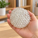 Glass bubble squishy (Clear), held in a hand to show the real size