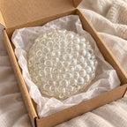 Glass bubble squishy crunchy (Clear), unboxed from a parcel with tissue paper