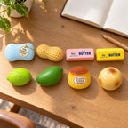 Crunchy Squishy Set, 8 Handmade Pieces, on a desk with a notebook and pencil