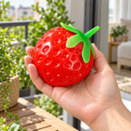 Crunchy Strawberry Squishy, Handmade, held in a hand to show the real size