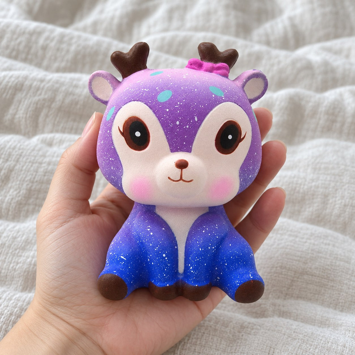 Galaxy deer squishy slow rising, held toward the camera, first-person view