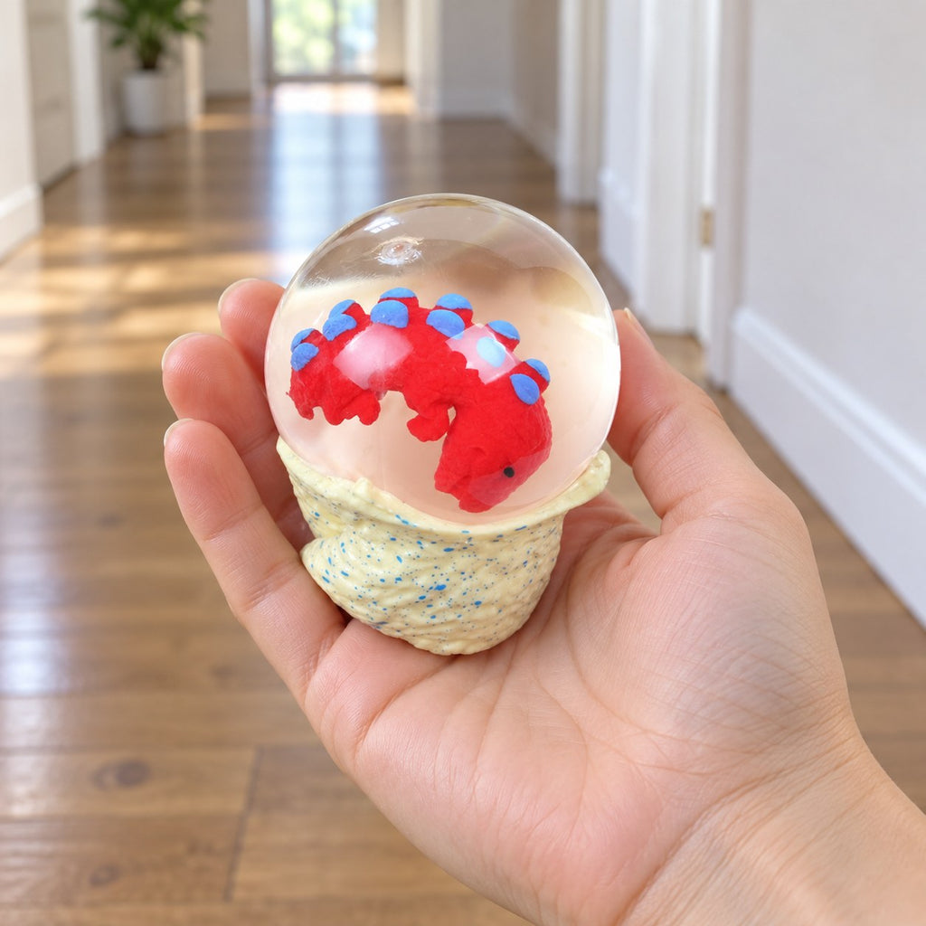 Dinosaur Egg Squishy, Water Ball with Baby Dino, held in a hand to show the real size