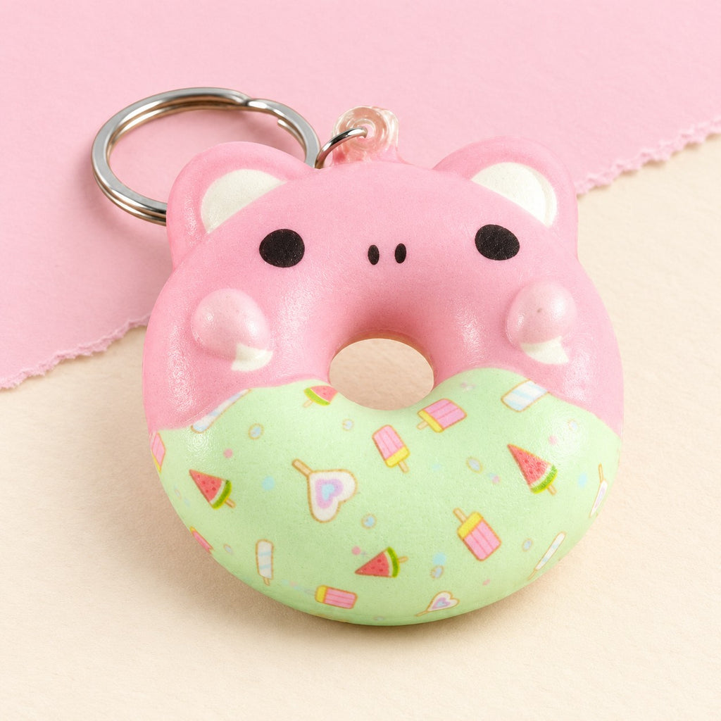 Donut squishy keychain with animal face slow rising, product photo on pastel paper