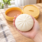 Bao Dumpling Squishy in Steamer Basket, held in a hand to show the real size