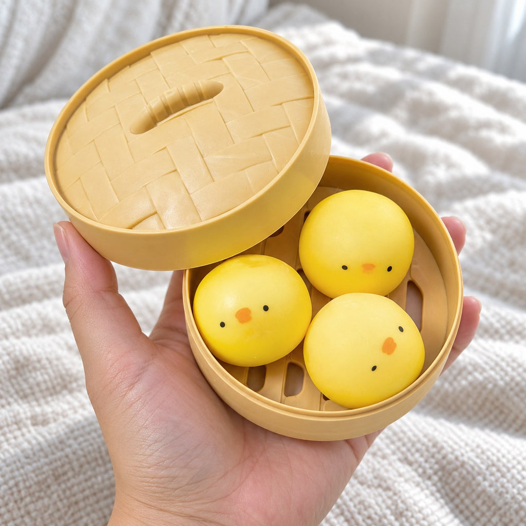 Chick Bao Squishy, 3 Buns in Steamer Basket, held toward the camera, first-person view