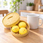 Chick Bao Squishy, 3 Buns in Steamer Basket, next to a coffee mug for size comparison