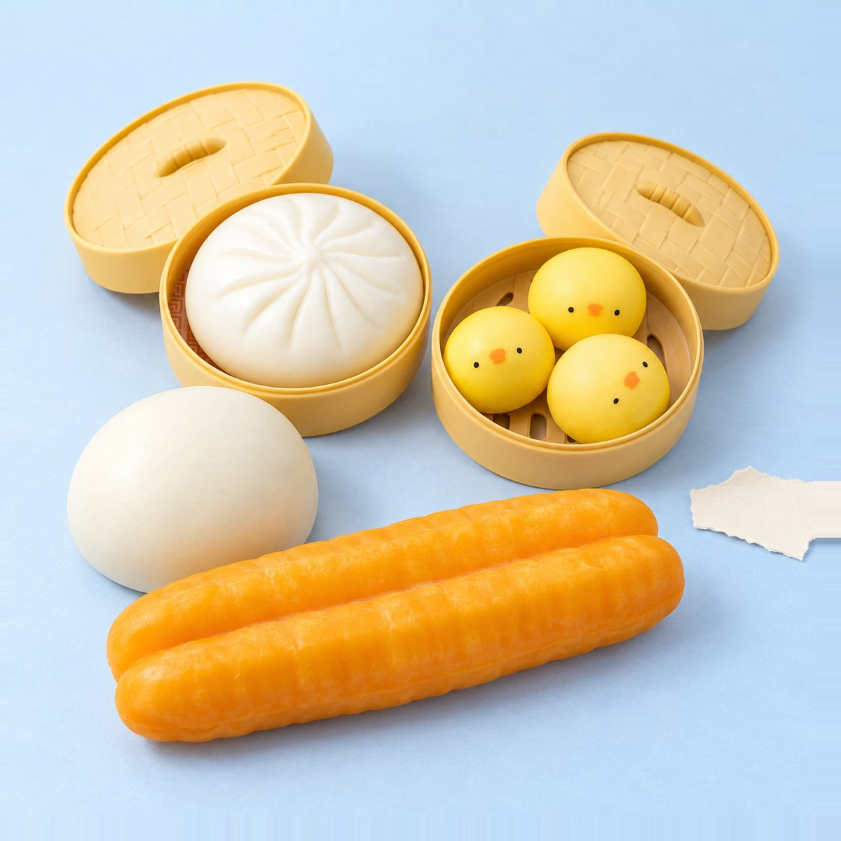 Dumpling squishy set van 4 op pastelkleurig papier