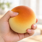 Steamed Bun Squishy, Slow Rising PU, 9 cm (golden), being squeezed by hand, soft and squishy