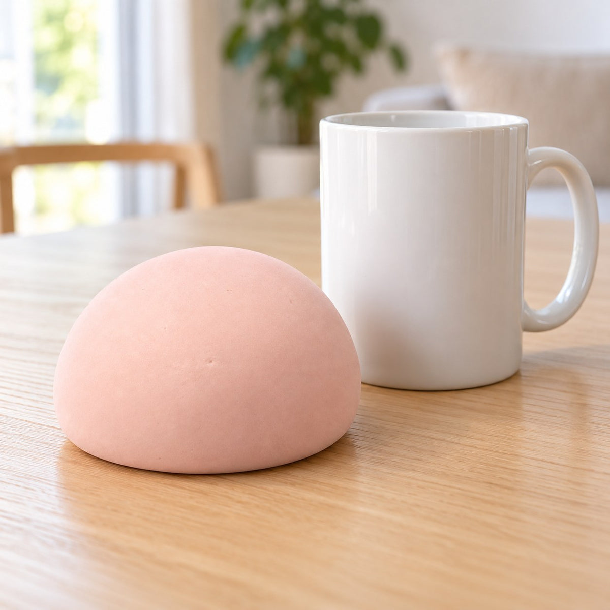 Steamed Bun Squishy, Slow Rising PU, 9 cm (pink), next to a coffee mug for size comparison