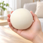 Steamed Bun Squishy, Slow Rising PU, 9 cm (white), held in a hand to show the real size