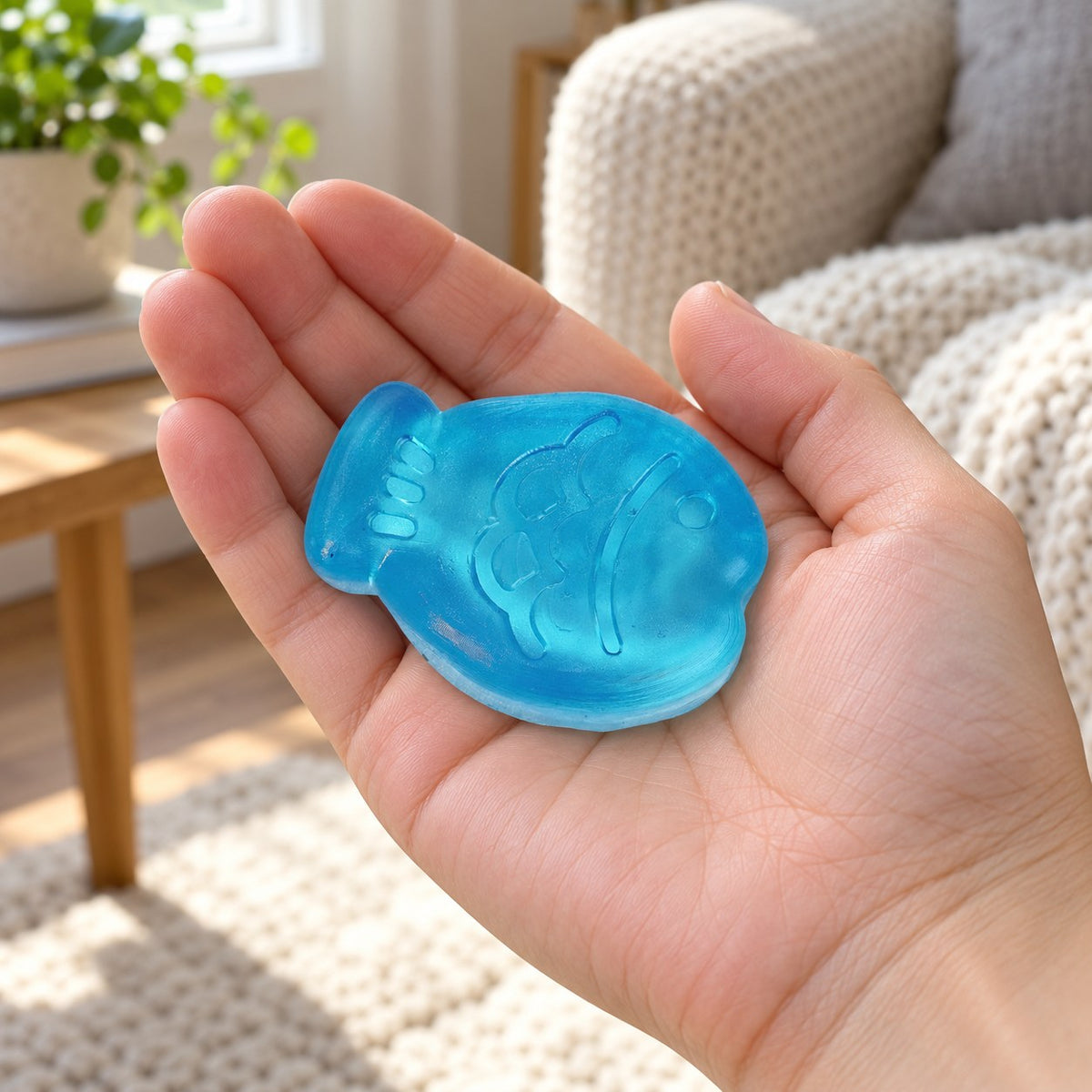 Mini jelly fish squishy (Blue), held in a hand to show the real size