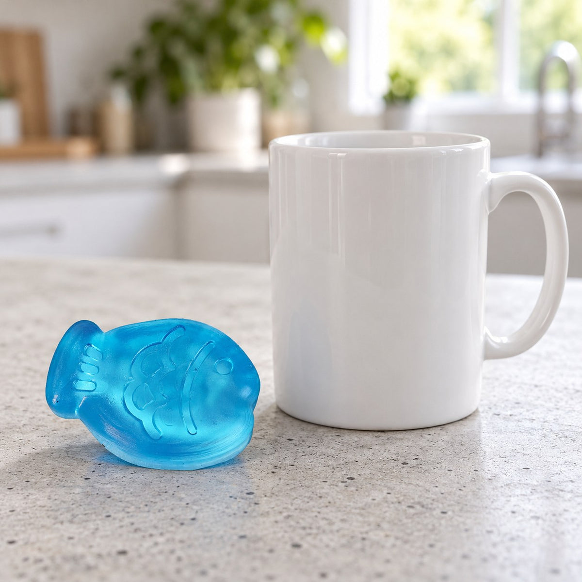 Mini Jelly Fish Squishy, 6 cm (Blue), next to a coffee mug for size comparison