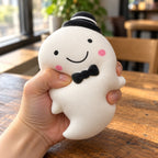 Slow Rising Ghost Squishy, 14.5 cm (white), being squeezed by hand, soft and squishy
