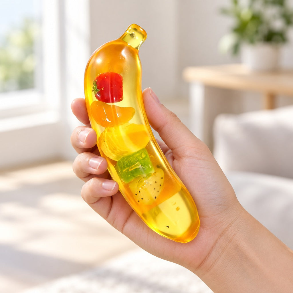 Giant Banana Squishy, Jumbo Slow Rising, held in a hand to show the real size