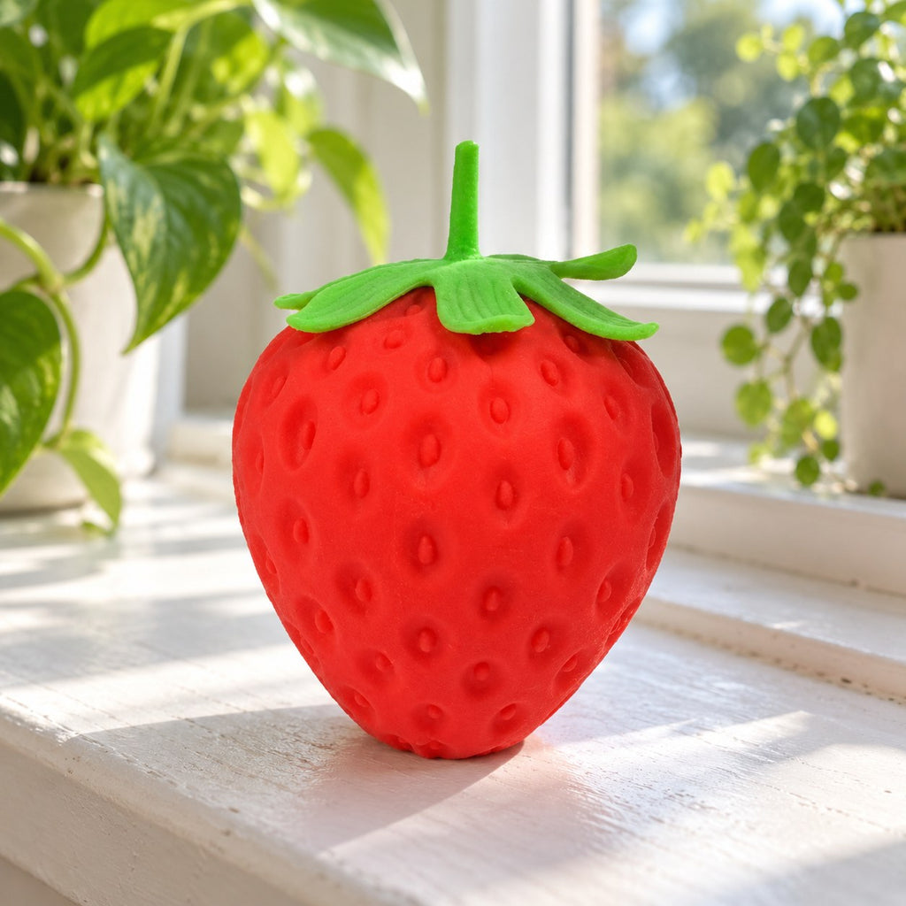 Strawberry squishy, on a sunny windowsill
