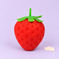 Giant strawberry squishy – Giant Strawberry Squishy, Jumbo Slow Rising, product photo on pastel paper
