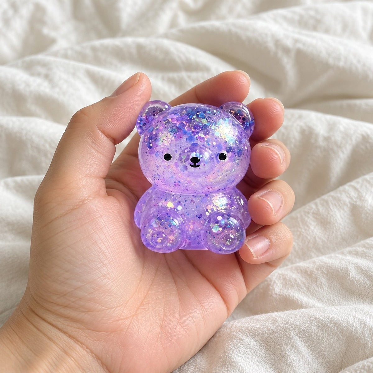 Glitter Bear Squishy, Maltose Jelly, 3 Sizes, held toward the camera, first-person view