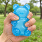 Gummy Bear Squishy, Slow Rising (blue), being squeezed by hand, soft and squishy