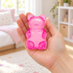 Gummy Bear Squishy, Slow Rising (pink), held in a hand to show the real size