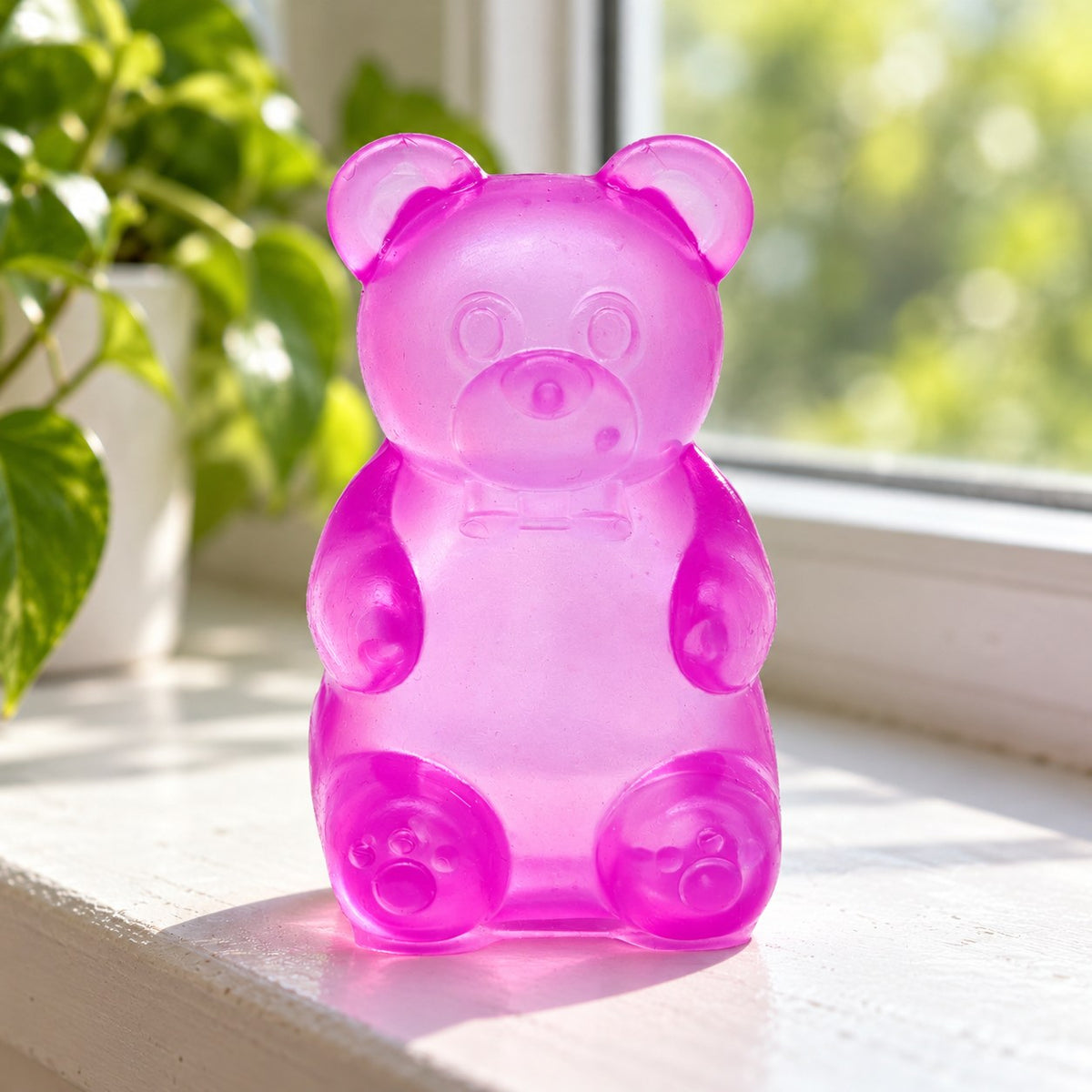 Gummy bear squishy slow rising (purple), on a sunny windowsill