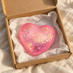 Glitter Heart Squishy, Maltose Style 6.7 cm (pink), unboxed from a parcel with tissue paper
