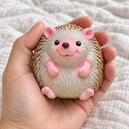 Hedgehog squishy soft, held toward the camera, first-person view