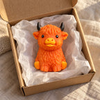 Highland cow squishy crunchy soft (Orange-brown), unboxed from a parcel with tissue paper