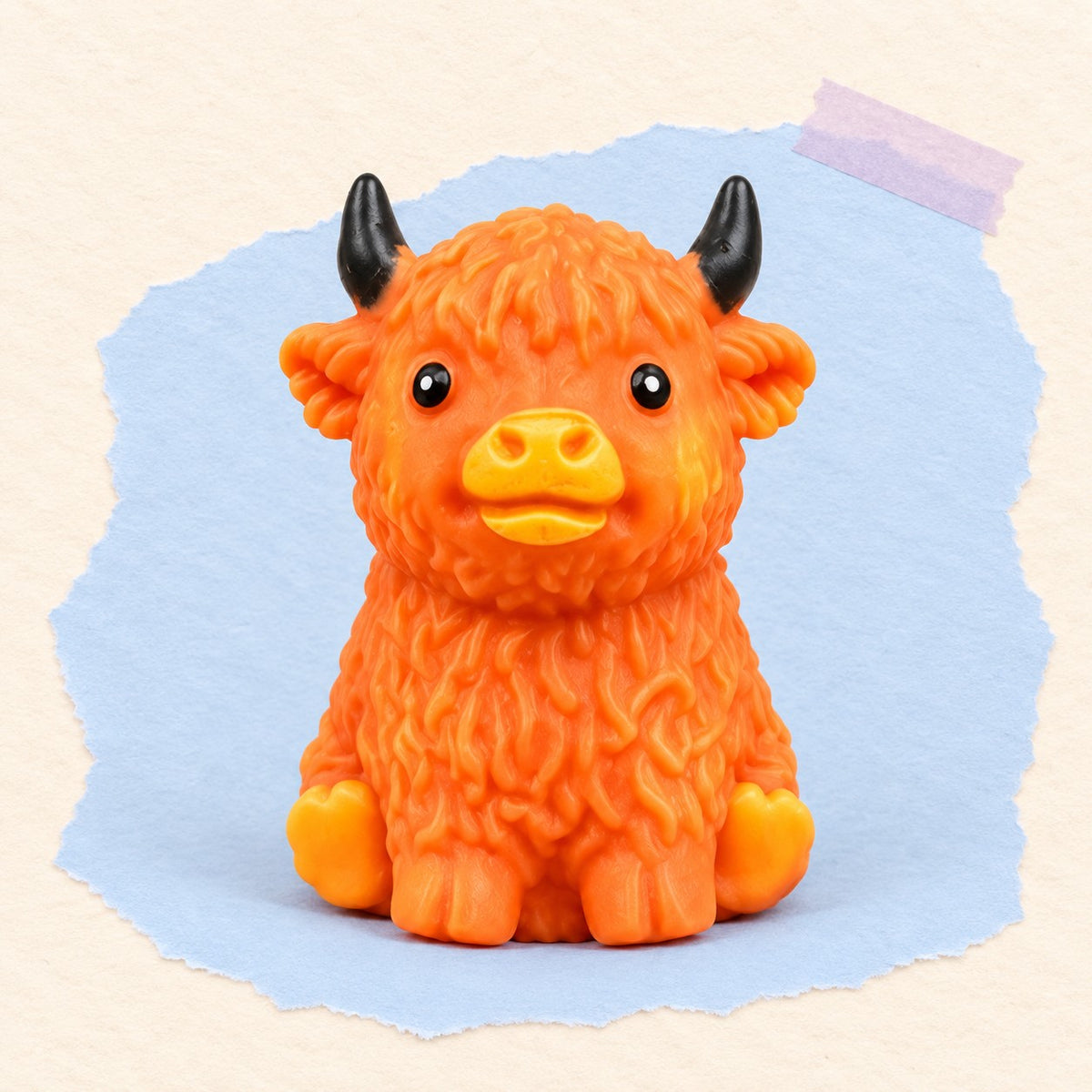 Highland cow squishy crunchy soft – Highland Cow Squishy, Creaky Block Filling (Orange-brown), product photo on pastel paper