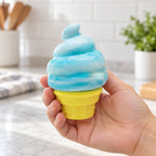 Ice Cream Cone Squishy, Stretchy Silicone (blue), held in a hand to show the real size