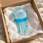 Jellyfish squishy (blue), unboxed from a parcel with tissue paper