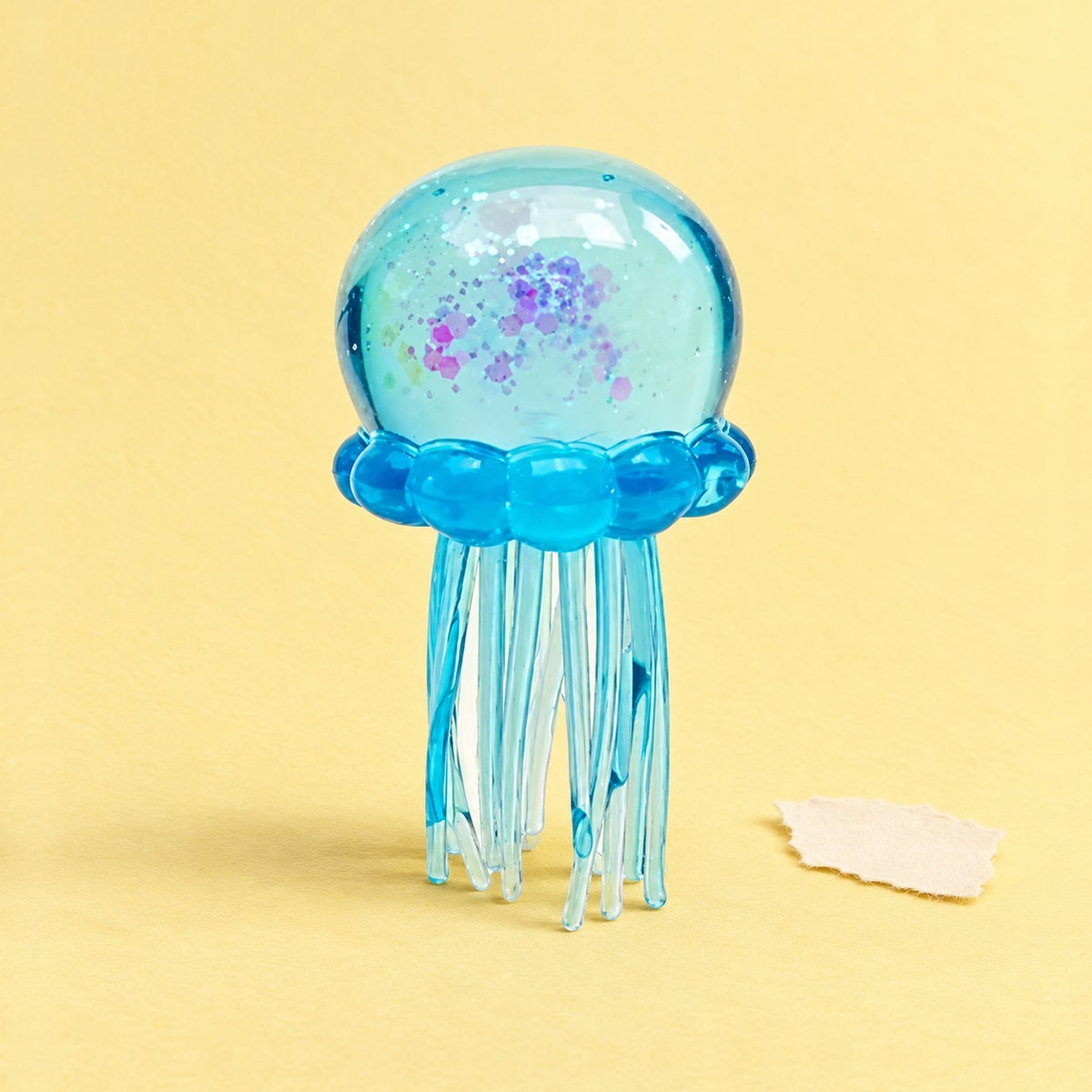 Jellyfish squishy with glitter – Jellyfish Squishy with Glitter, Soft TPR (Blue), product photo on pastel paper