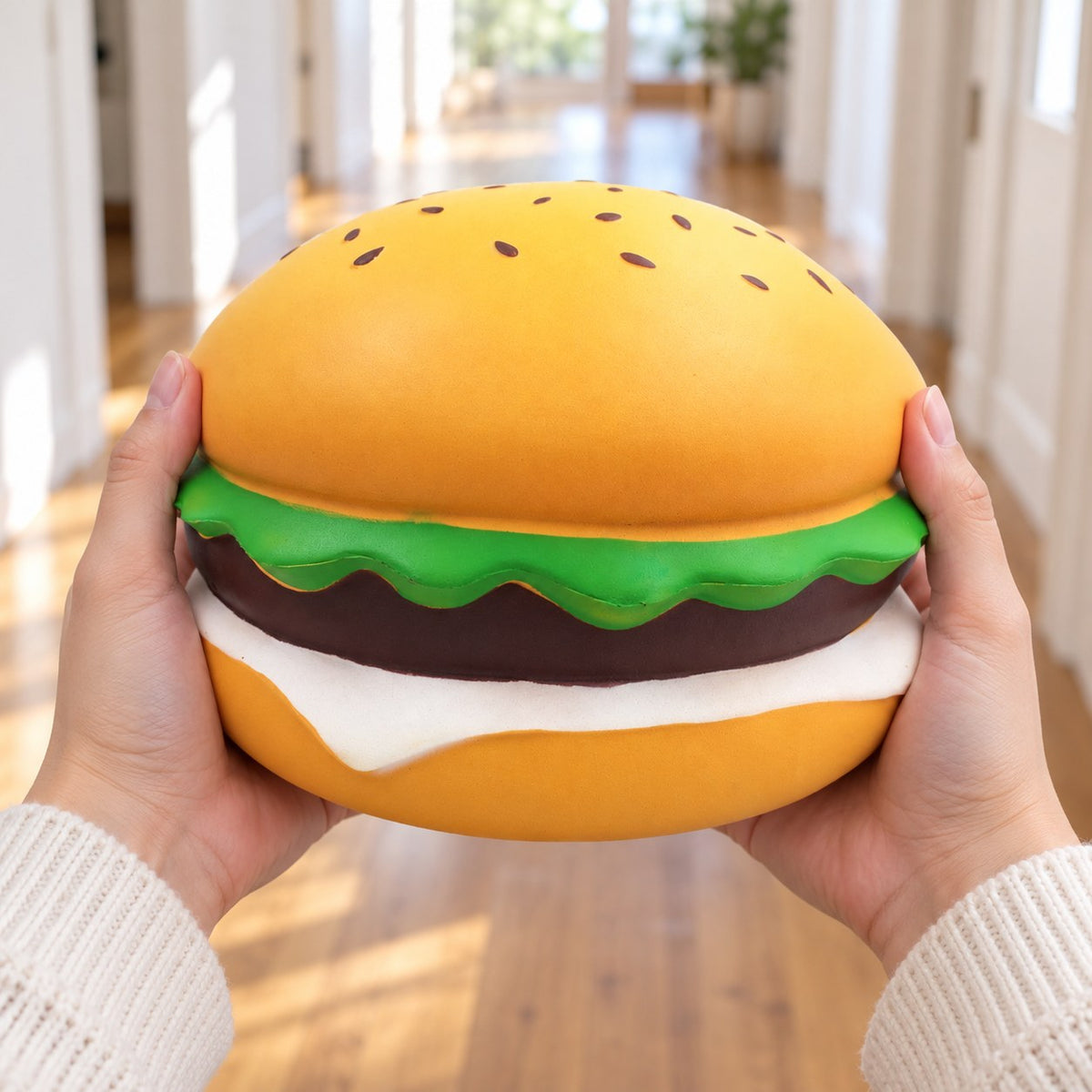 Jumbo burger squishy giant sesame burger 24 cm, held in both hands to show the big size