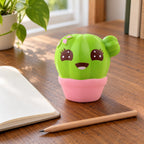 Jumbo Cactus Squishy, Kawaii, on a desk with a notebook and pencil