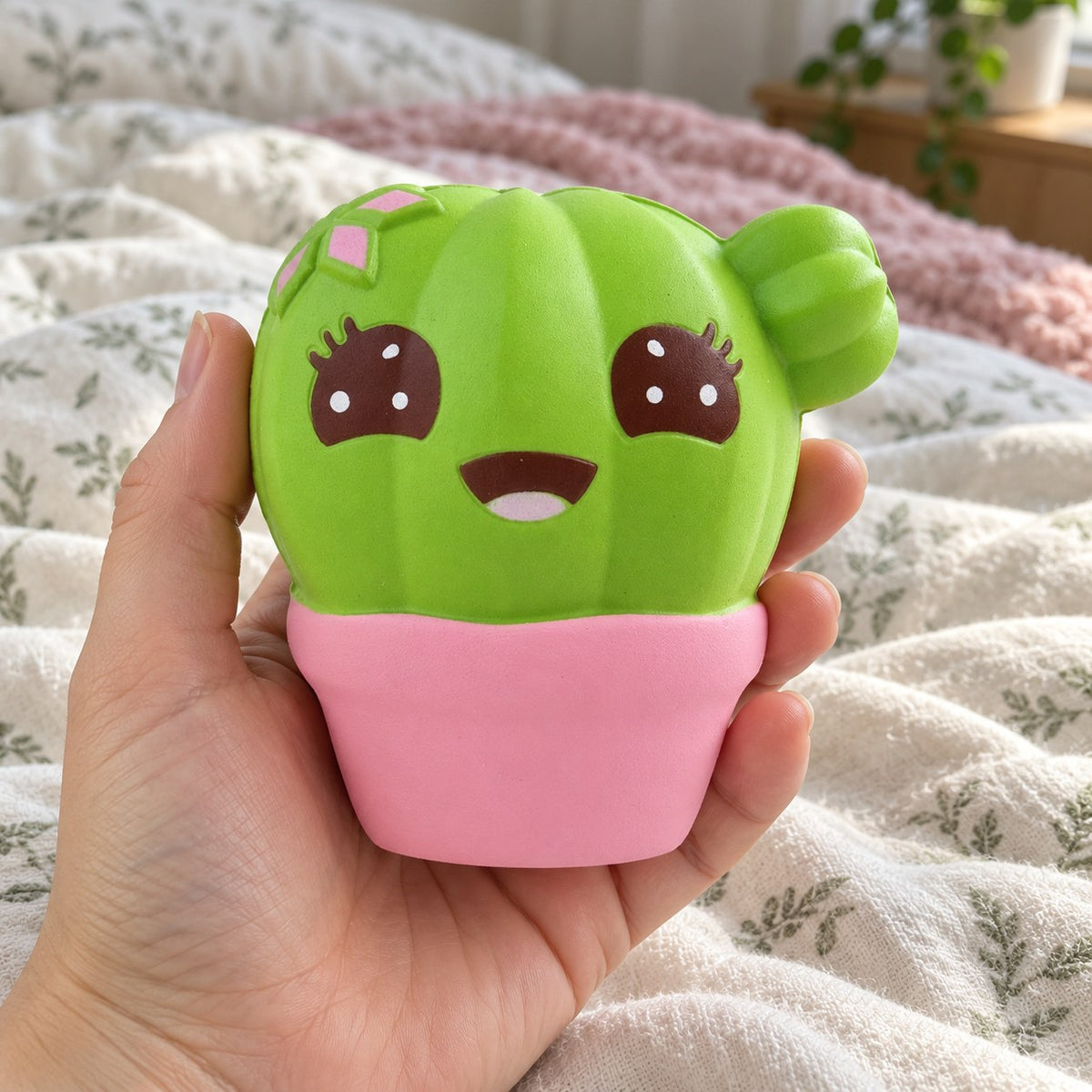 Cactus squishy jumbo, held toward the camera, first-person view