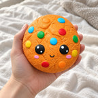 Candy cookie squishy, held toward the camera, first-person view