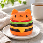 Jumbo Cat Burger Squishy, Orange, on a plate on a breakfast table