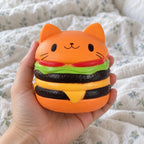 Burger squishy jumbo, held toward the camera, first-person view