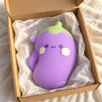 Squishy melanzana jumbo, faccina kawaii, appena tolto dal pacco con carta velina