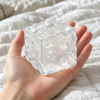 Cheese squishy jumbo (white), held toward the camera, first-person view