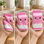 Milk carton squishy jumbo (pink), squished flat, half risen and fully back in shape