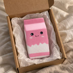Milk carton squishy jumbo (pink), unboxed from a parcel with tissue paper